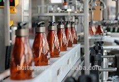 Hair shampoo conical bottle lotion dispenser pump capping machine with puck system